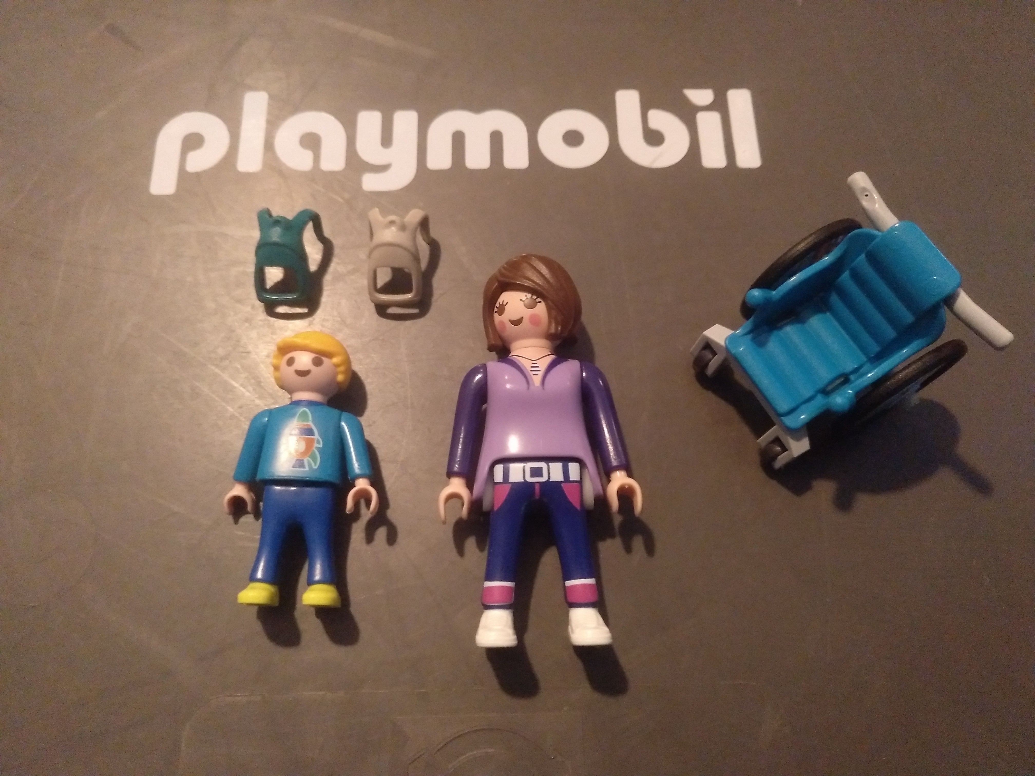 PLAYMOBIL MADRE CON HIJO Y SILLA DE RUEDAS EN BOLSA CERRADA